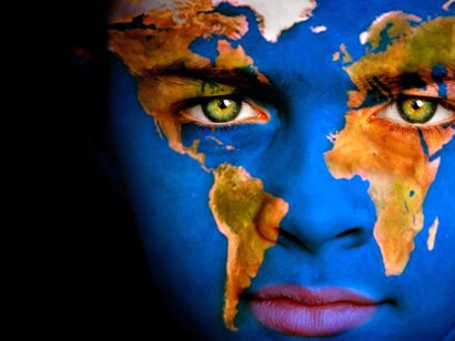 Portrait of a boy with a map of the World painted on his face