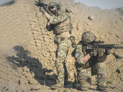 Two soldiers in the arid desert
