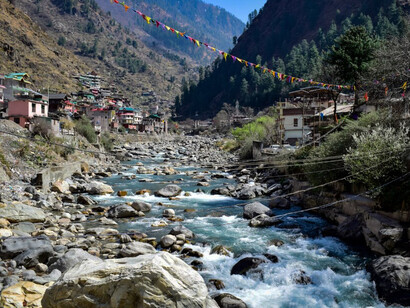 Manikaran, Himachal Pradesh, offers a breathtaking landscape where the river carves its path between the steep mountains, India