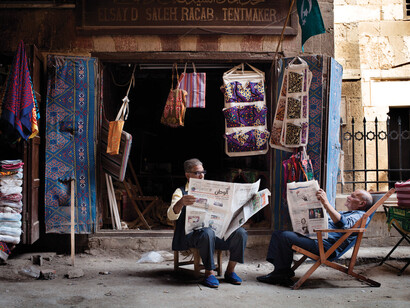 Sayyed Elsay and a friend reading dailies, Cairo, Egypt: 2013 © Massimiliano Fusari / Massimedia.com