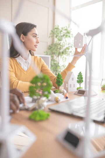 A female engineer leads an environment project, focusing on eco-friendly buildings and sustainable construction materials and designs