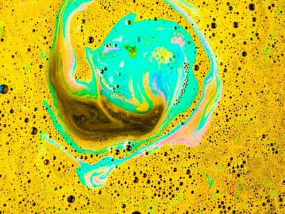 Yellow and turquoise abstract art embodies absurdity and surrealism through its vibrant, unconventional color contrasts and imaginative forms