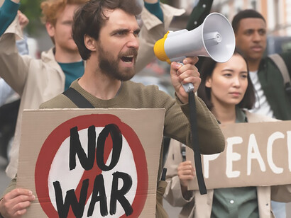 In a compelling display of solidarity, a gathering of young activists takes center stage in an anti-war protest, united in their message as they raise cards proclaiming, "No war"