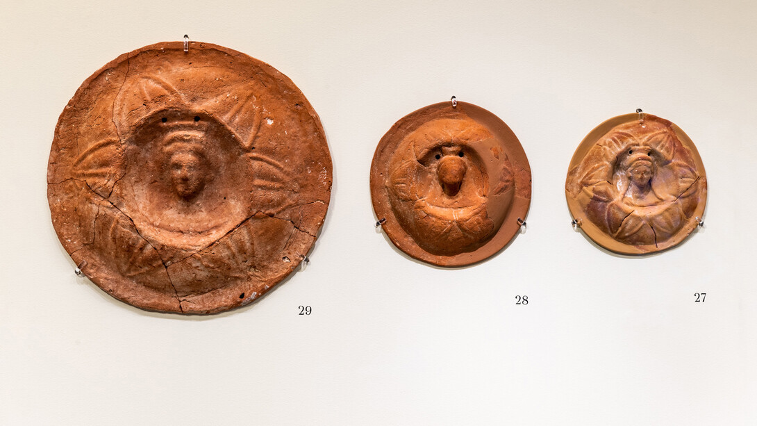Terracotta calyx medallion with bust
1st – first half of 2nd c. AD
Thought to have been offered in lieu of actual flowers, or to have served some other ritual function.