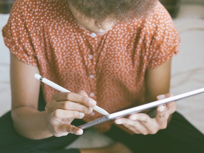 Young student doing home-work. Digital literacy, reasons to implement this knowledge in our teaching practice, and ways to do so