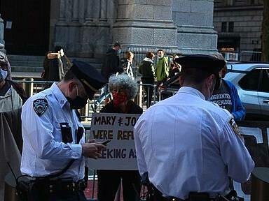 Woman protesting for asylum seekers, Newyork City, 2020