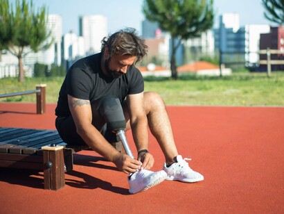 A man preparing for a workout outdoors, representing the importance of taking one small step toward a healthier routine