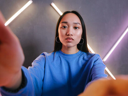 Her eyes are fixed on her phone, clearly intrigued by the latest content that’s driving forward her understanding of business and innovation
