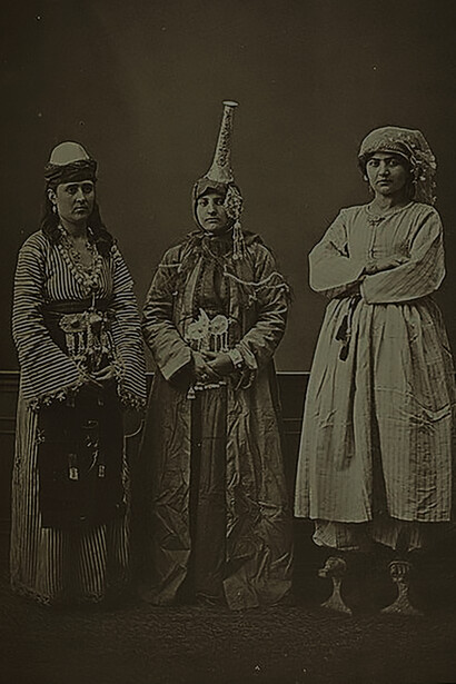 Studio portrait of models wearing traditional clothing from the province of Syria, Ottoman Empire