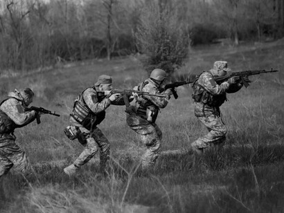 Ukrainian soldiers. The Russian military intervention in Ukraine since 2014 against peaceful NATO and EU efforts to draw all of Ukraine into both military and political-economic alliance are leading to a new partition of Ukraine