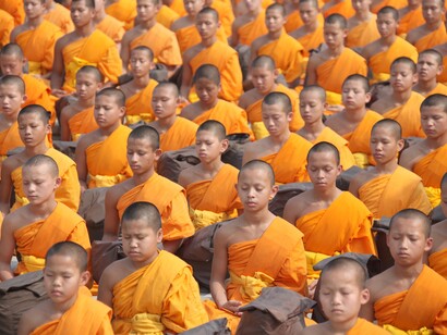 Buddhist monks in prayer, believing in faith and religion