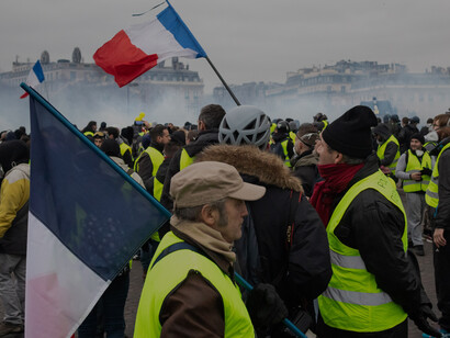 Protesters display a revolutionary slogan during the Yellow Vest demonstration at Place de la République, Paris, February 2, 2019 France— part of a movement that began over fuel taxes and grew into a nationwide revolt against inequality and political elites