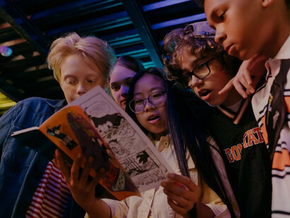 Kids engrossed in comic book tales