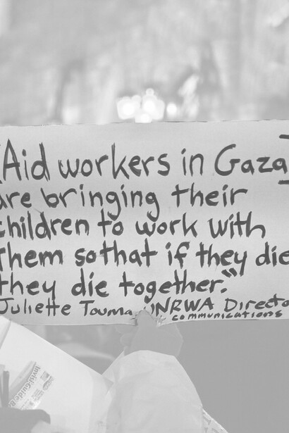 A placard discussing the plight of Palestinian aid workers