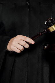A female judge with gavel, symbolizing authority and justice