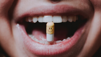 A woman gracefully takes her medication, swallowing it with ease and assurance
