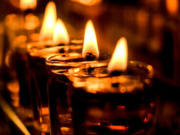 Warm candlelight with flickering flames, guiding the path ahead