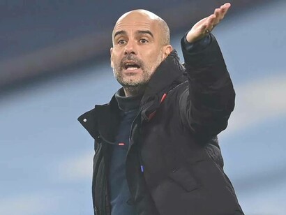 Manchester City manager Pep Guardiola gesticulating his displeasure during a match