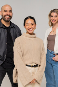 Stanley Henry, CEO and Co-Founder of The Attention Seeker, Jony Lee, Strategist at The Attentions Seeker, and Claire Wallace, Co-Founder of the Attention Seeker, stand alongside each other proudly, reflecting the strong leadership at the helm of the growing and innovative company