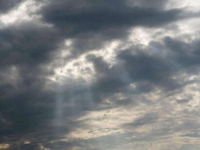 Virtuous ambition rises like light through the clouds, illuminating paths beyond the self.