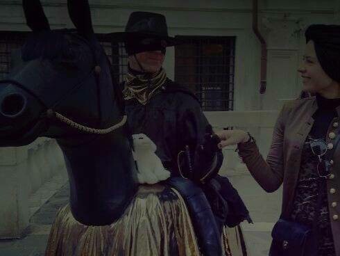 Hiba with a man on a horse in Saint Mark Square in Venice, Italy