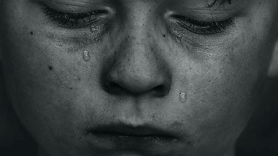 A young boy consumed by shame