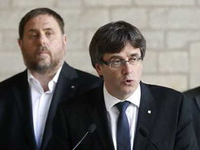 El presidente de la Generalitat, Carles Puigdemont (derecha), y el vicepresidente Junqueras 