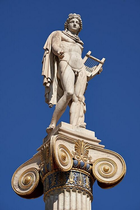 The statue of Apollo by Greek sculptor Leonidas Drosis stands atop a column at the Academy of Athens in Athens, Greece