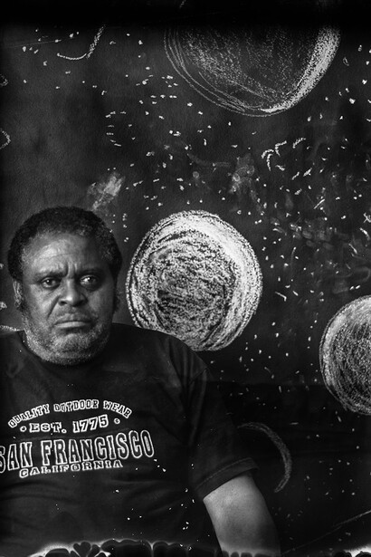 Jeannie O'Connor, Creative growth artist Larry with chalkboard drawing, 2016. Courtesy of Transmission Gallery