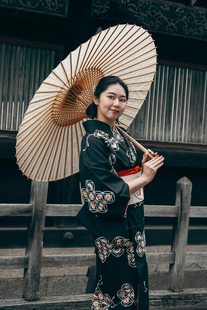 A Japanese woman in a kimono holding a parasol, with references to traditional kimono pattern layouts, fabric folding, and cutting diagrams, Kyoto, Japan