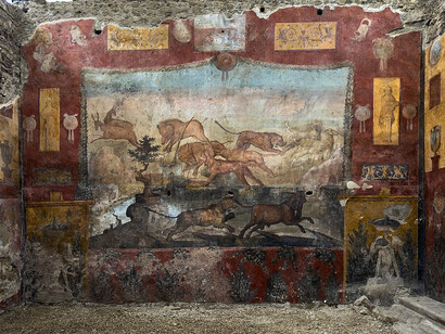 A large predator-and-prey fresco decorates the peristyle garden of the House of the Ceii in Pompeii, Italy