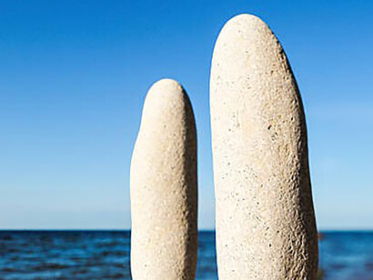Balance achieved between two stones near the sea