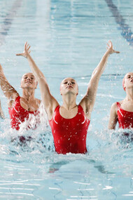 Experience the mesmerizing spectacle of synchronized dancing by women in a pool, blending grace and harmony in captivating movements