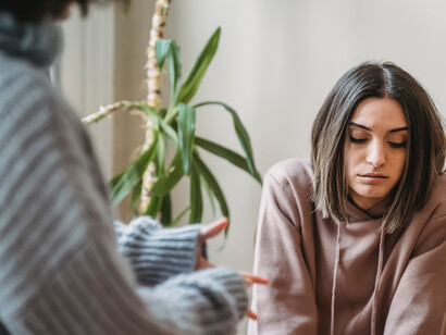 A women looks sad as her partner argues