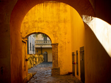 Historic archway along a narrow street in the medina of Marrakesh, Marrakesh–Safi, Morocco