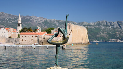 The ballerina of Budva with the Old town in the background