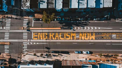 Sign on the road 'end racism now'