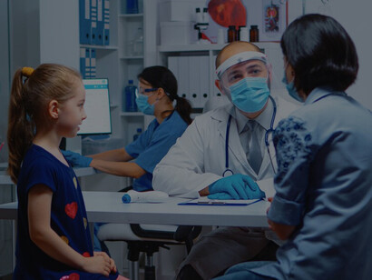 A pediatrician specialist in medicine, wearing a mask, delivers comprehensive healthcare services, consultations, and treatments in a hospital setting amidst the COVID-19 pandemic, prioritizing the well-being of young patients