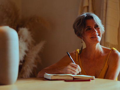 In the quiet of her writing space, she turns the act of journaling into a powerful tool for self-discovery and clarity