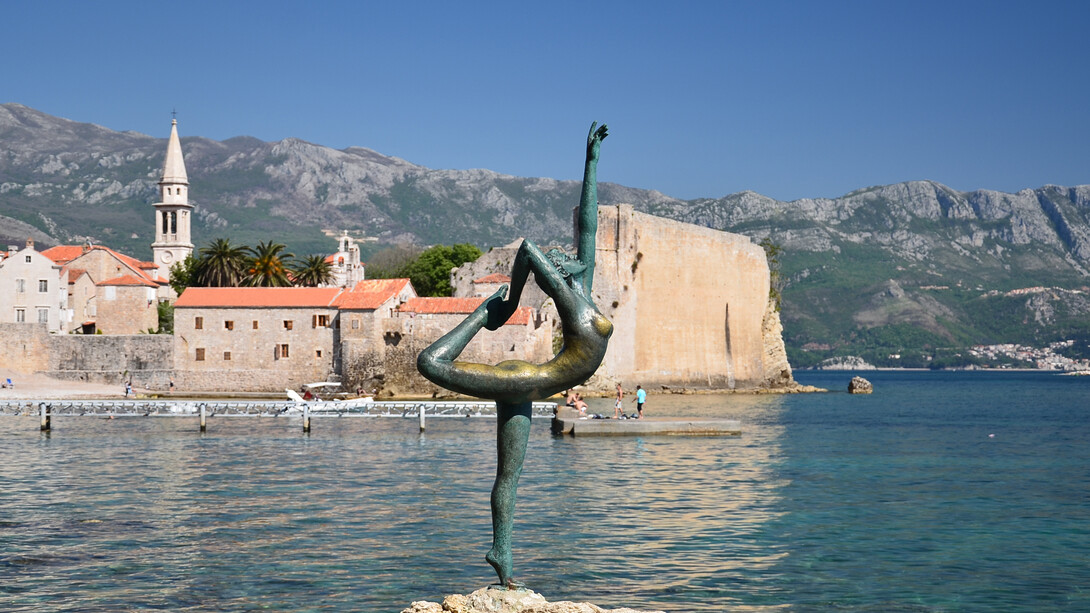 The ballerina of Budva with the Old town in the background