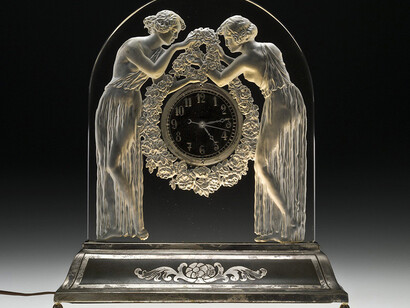 René Lalique, Designer, Lalique et Cie, Manufacturer, Deux figurines (Two figures)
Clock with illuminated base: Colorless glass, mold-pressed; metal clock parts, assembled.
Designed 1926