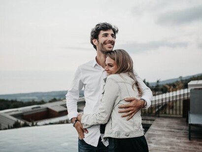 Couple hugging and loving one another, smiling happily