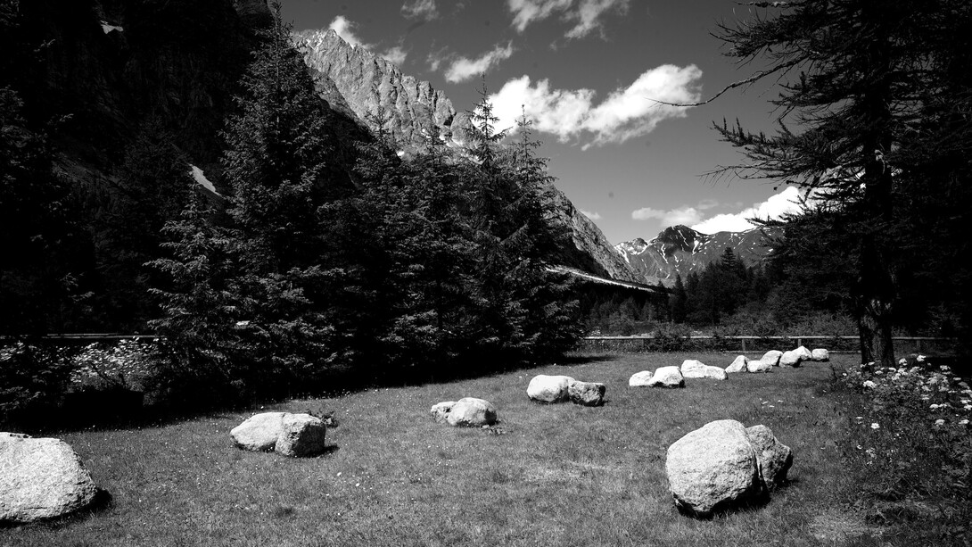 Richard Nonas, Bones, 2014, 36 Mont Blanc granite boulders, Two perpendicular lines, each 28 meters long, Val Ferret, Courmayeur, Italy. ©Richard Nonas. Courtesy of Fergus McCaffrey Gallery