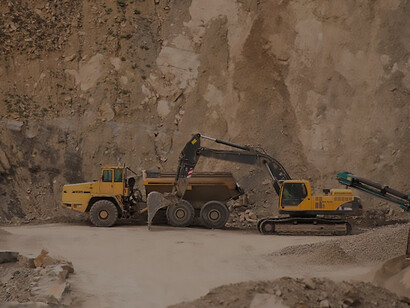 In the Podkarpackie region of Poland, construction equipment disrupts the serene forest as it clears the way for a new mine, leaving a trail of destruction in its wake