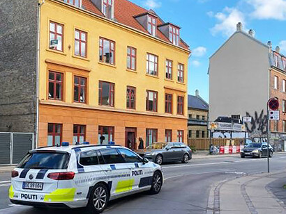A patrol car stationed at Nordre Fasanvej in Nørrebro, Copenhagen, serves as a vigilant presence, ensuring safety and security within the urban landscape