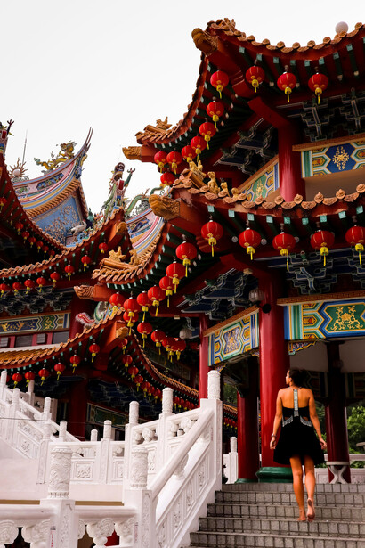 A woman exploring the grandeur of a temple in Kuala Lumpur, Malaysia