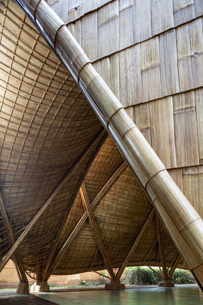 Detailed weaving patterns highlight how traditional techniques support cutting-edge design in The Arc's bamboo framework at Green School in Bali, Indonesia