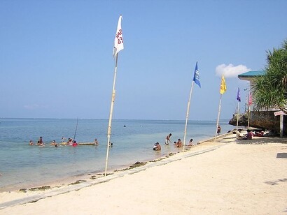 Families relax at Patar Beach, Pangasinan, Philippines