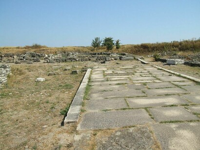 A road in Histria (Sinoe) presumed to be of Roman origin, Romania (The rectangular blocks are not true Roman construction.)