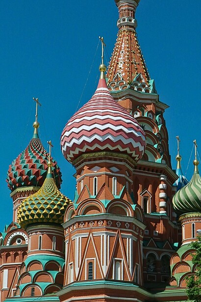 Saint Basil’s Cathedral’s vividly patterned domes in Moscow, Russia, reflecting a Russia far more colourful and complex than the grey landscape the author once expected